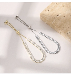 Macro detail of adjustable cubic zirconia box chains in gold and silver finishes