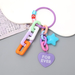 Detail of candy color acrylic keychain with chunky chain and heart star pendants