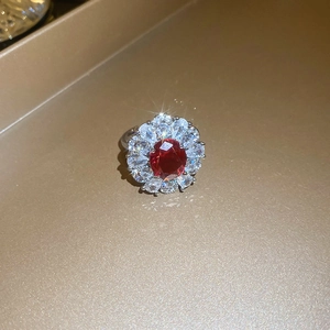 Elegant floral red gemstone ring with double-layered cubic zirconia and silver-toned band