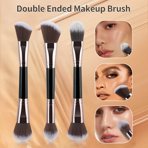 Detail of double-ended makeup brush with foundation and powder brush heads for blending