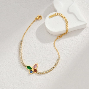 French vintage gold butterfly bracelet with colorful zircon stones on white stone