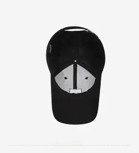 Detail view of black cotton baseball cap interior showing reinforced lining and sweatband