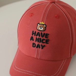 Red kids' baseball cap with embroidered crown bear and 'Have a Nice Day' slogan
