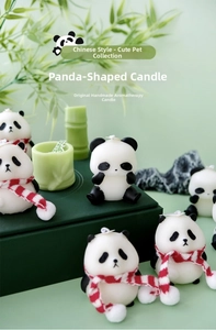 Detailed view of handmade panda-shaped scented candles and bamboo-style candle accessory