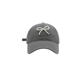 Deep grey cotton baseball cap with pearl bow decoration and minimalist soft top design