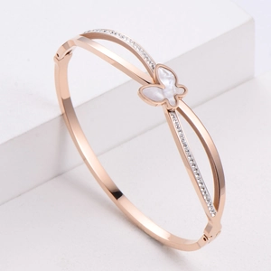 Rose gold butterfly bangle featuring white shell inlay and sparkling cubic zirconia stones