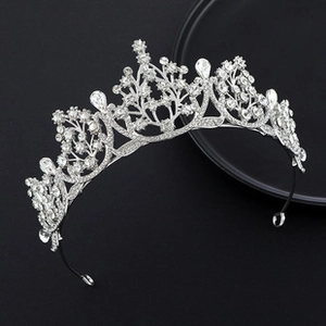 Exquisite silver alloy crown with sparkling rhinestones and teardrop jewels on a black base