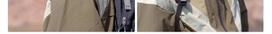 Close-up of ripstop nylon fabric with color-block panels and adjustable strap detail