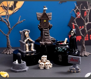 Detailed view of Halloween resin miniatures including skull pile and Death Day sign