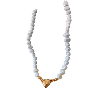 Elegant Baroque freshwater pearl necklace featuring a polished golden heart magnetic pendant