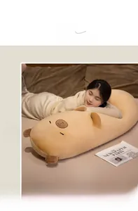 Soft capybara long plush pillow being held by a model for a cozy sleeping scene