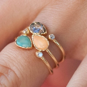 Three-piece stackable teardrop rings with colored gemstones and pavé accents in gold