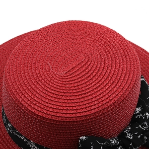Red straw boater hat for women with floral ribbon bow and wide brim for sun protection