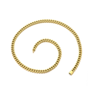 Golden stainless steel Cuban link necklace displayed in a creative spiral arrangement