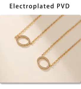 Macro shot of 18k gold plated PVD necklace featuring a sparkling crystal oval pendant