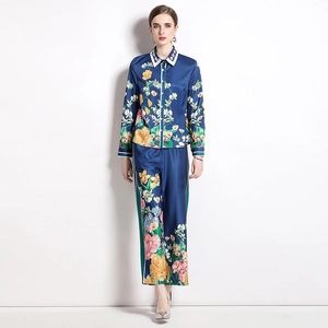 Women's two-piece set featuring long sleeve floral shirt and wide leg trousers in deep blue