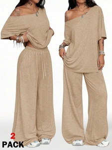 Detail of light khaki two-piece lounge set with off-shoulder top and wide-leg trousers