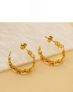 Detailed view of 18K gold-plated stainless steel star hoop earrings with non-fade finish