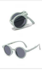 Foldable kids round sunglasses in mint blue showing folded and unfolded positions