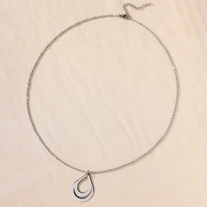 Detail of silver water drop necklace with double-layered hollow pendant and lobster clasp