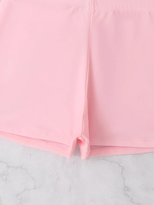 Detailed shot of pink quick-dry swim shorts with smooth texture and double stitching