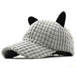 Winter warm baseball cap with cat ears and textured grey corduroy fabric