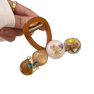Pince à cheveux ambrée pour femmes ornée de fleurs séchées et de feuilles d'or