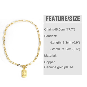 Detail of gold letter C pendant with size specifications on a paperclip chain