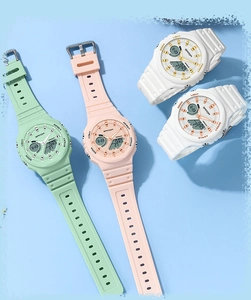 Detailed top view of SANDA dual-display watches in mint green, pink, and white colors