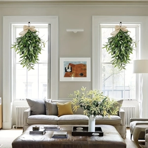 Artificial olive leaf door wreath with green foliage and beige burlap bow decor