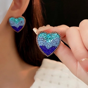 Vintage heart earrings featuring gradient green and blue crystals with a gold-tone finish