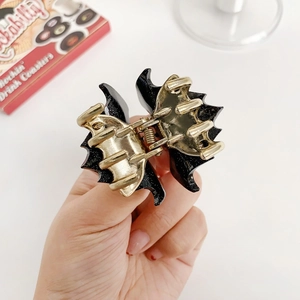 Halloween bat-shaped black acrylic hair claw clip with gold metal spring for ponytail