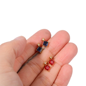 Square birthstone stud earrings in blue and red zircon with 18k gold plated finish