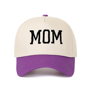 Close-up of MOM 3D embroidery on two-tone cotton baseball cap with purple brim