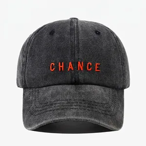 Classic washed black baseball cap with orange CHANCE embroidery and six-panel structure