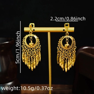 Detailed dimensions of gold bohemian teardrop tassel earrings on a display stand