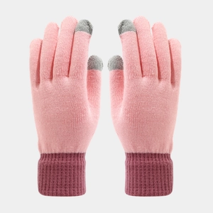 Detail of pink knitted gloves with grey touchscreen fingertips and ribbed cuffs
