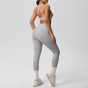 Detail of light grey yoga set with cross-back sports bra and high-waist leggings