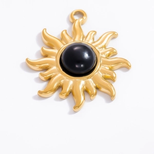 Detailed view of sun-shaped 18k gold plated pendant with central black obsidian stone