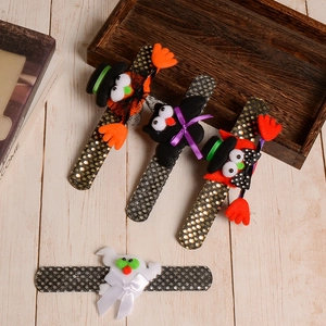 Glittery Halloween snap bracelets with pumpkin, bat and ghost characters for kids