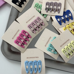Colorful drop-shaped metal hair clips set with matte finish in various candy colors