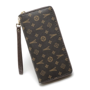 Macro view of long zipper wallet with dark brown monogram pattern and wrist strap
