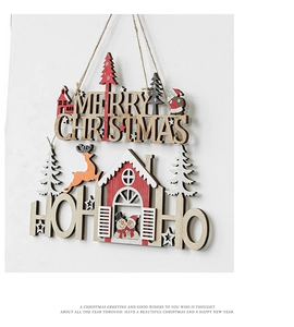Detail of wooden Merry Christmas hanging sign with snowman and reindeer laser-cut ornaments