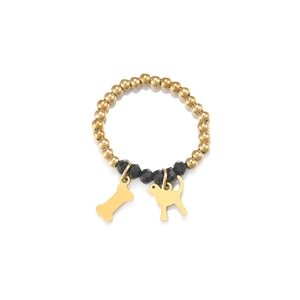 Detailed close-up of golden beaded pet ring featuring dog and bone charms on white background