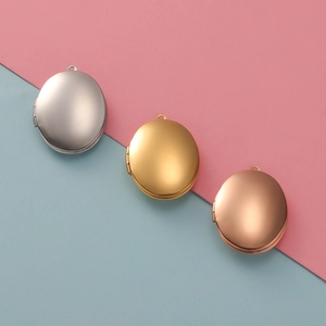 Three-color oval 316L stainless steel photo lockets in silver, gold, and rose gold finish