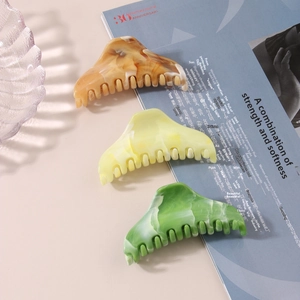Three-piece marble pattern acetate hair claw clip set with amber and green texture