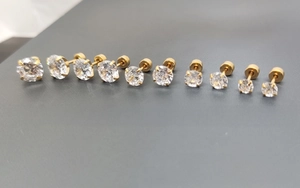 Detailed size comparison of gold plated 316L stainless steel stud earrings with cubic zirconia