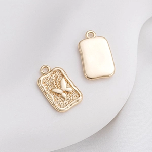 14K gold filled rectangular pendant with embossed butterfly and smooth finish