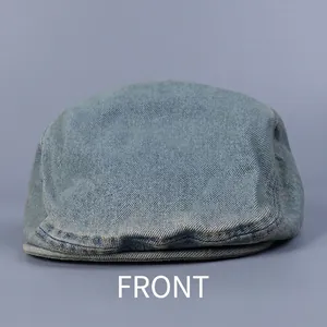 Front view of a light blue washed denim flat cap with premium twill texture for men and women