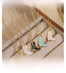 Detail view of colorful cowboy boot pendant necklaces in red white black blue and pink